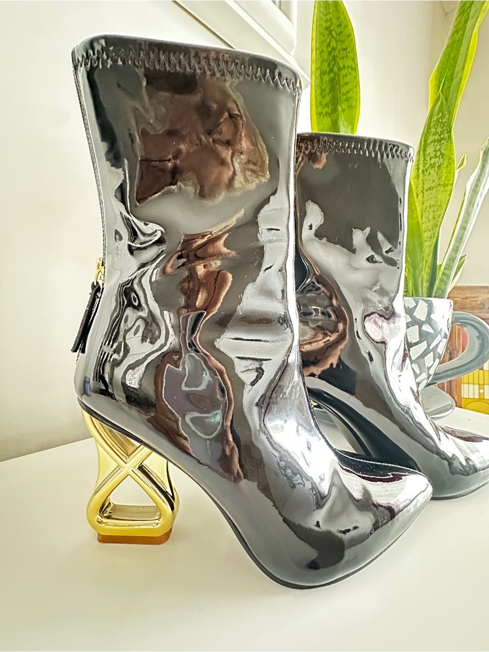 Steve Madden Black Patent Ankle Booties with Sculptural Gold Heel